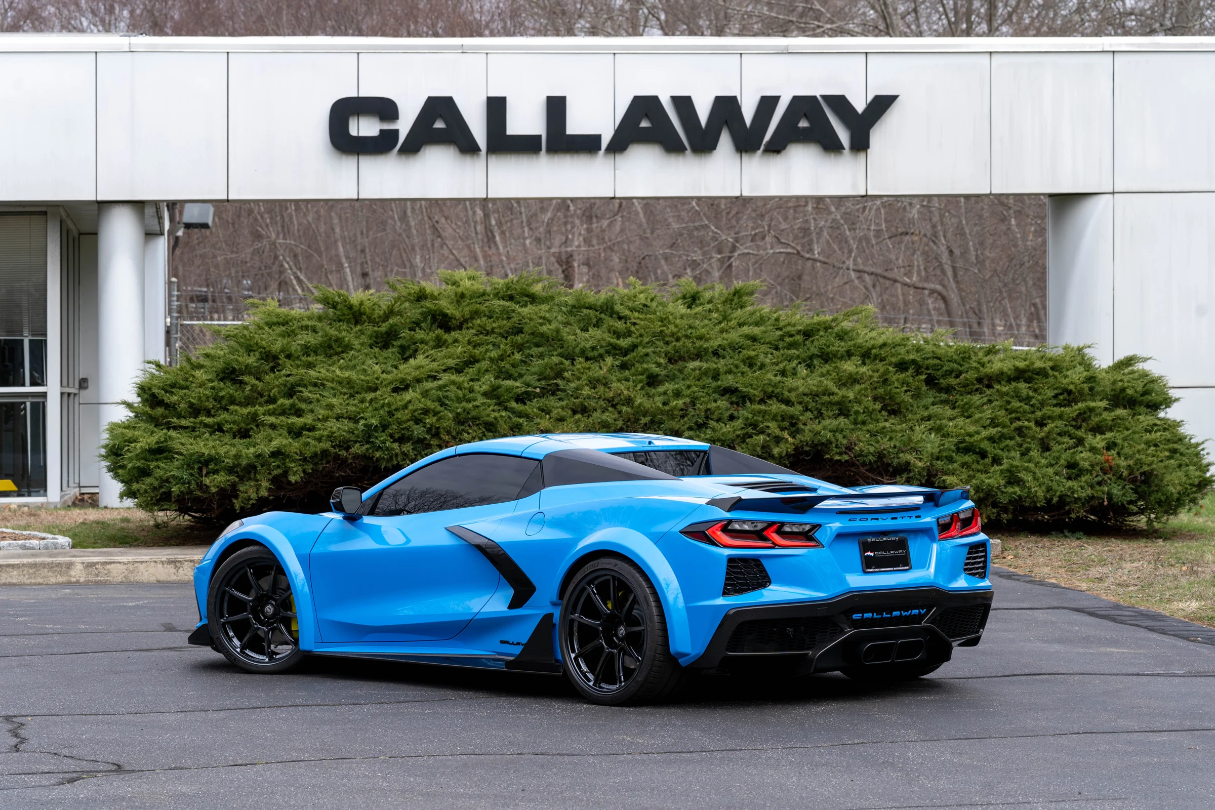 Rear three-quarter view of the blue Callaway widebody Stingray outside the Callaway factory